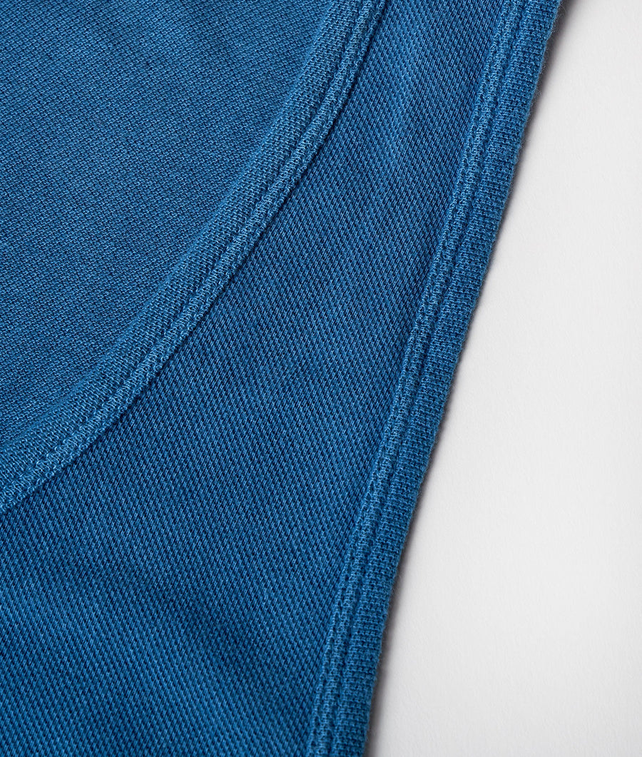 Close-up detail shot of a navy blue cotton fabric with a textured woven pattern - Industry of All Nations
