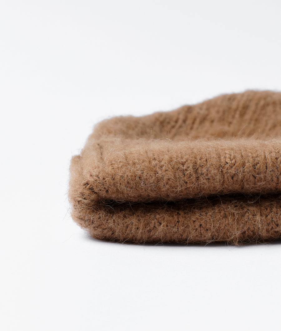 Close-up detail shot of a brown, fuzzy, wool or alpaca-blend fabric - Industry of All Nations