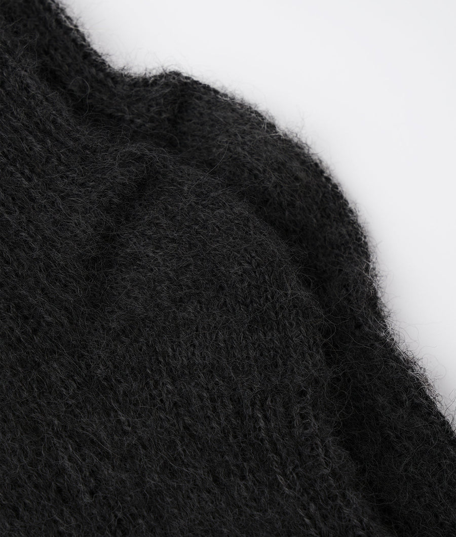 Black fuzzy wool sweater in close-up detail shot - Industry of All Nations