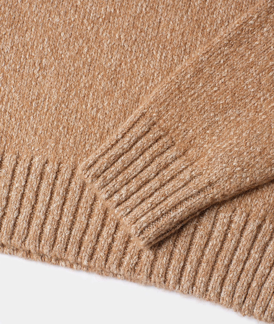 Detail shot of a tan, ribbed knit scarf made of organic cotton and alpaca - Industry of All Nations