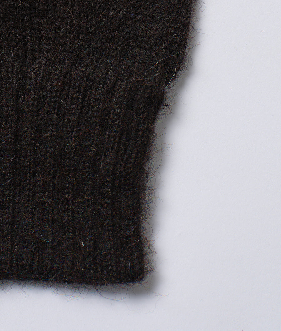 Detail shot of a black woolen fabric with uneven texture - Industry of All Nations