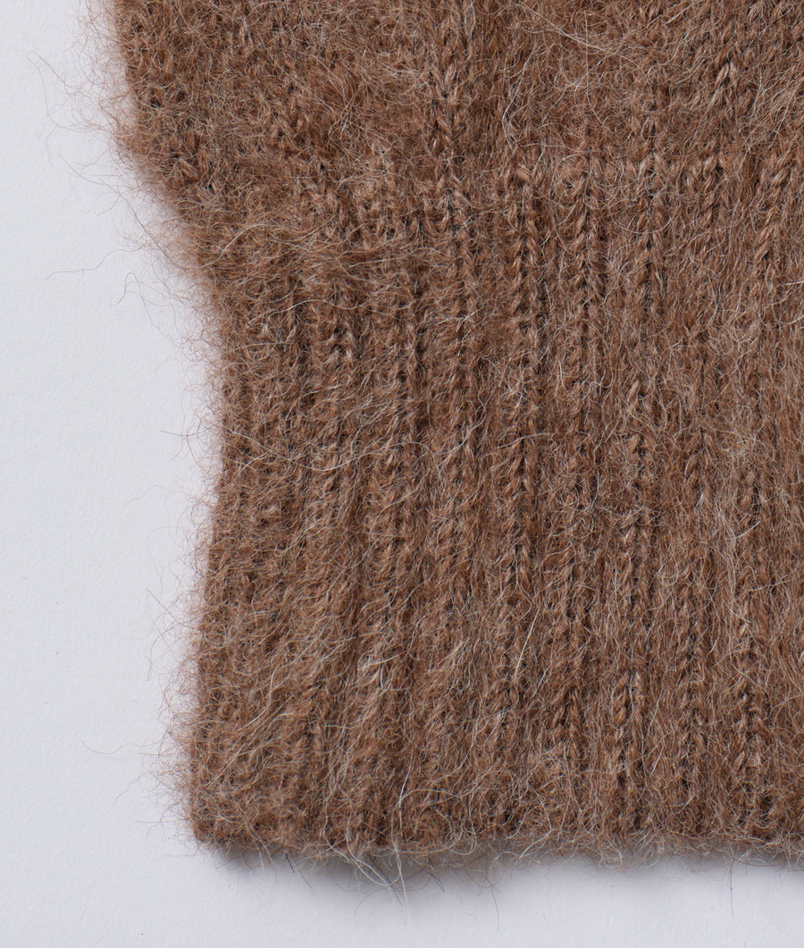 Close-up detail shot of a brown alpaca fiber fabric with a fuzzy, textured appearance - Industry of All Nations