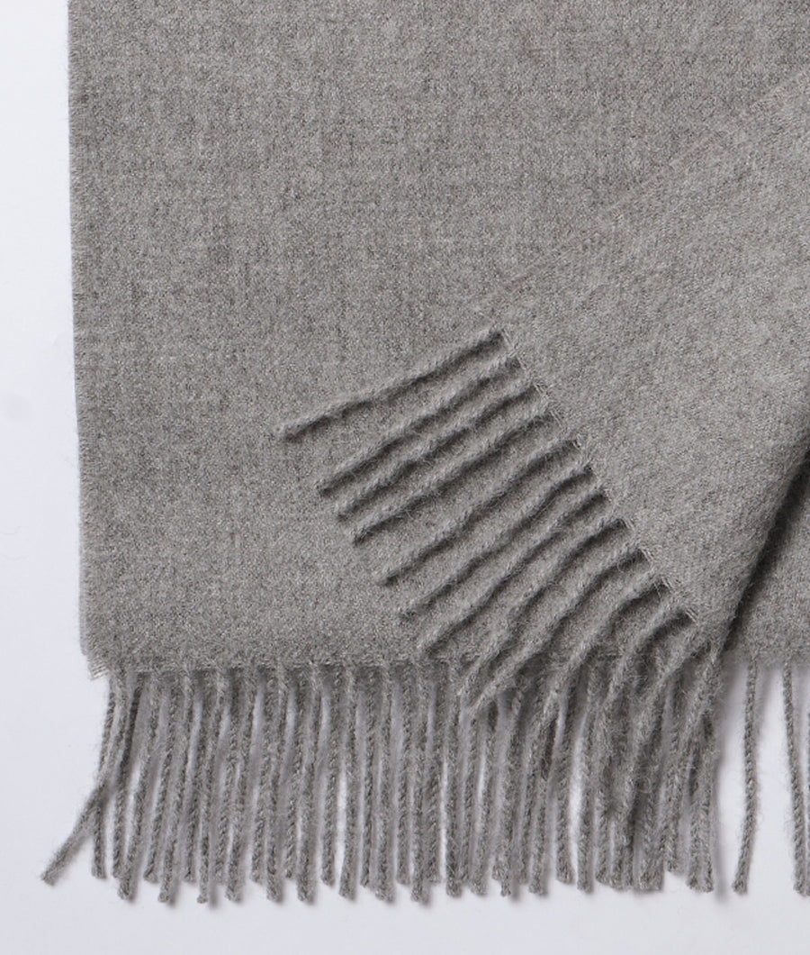 Gray alpaca scarf with fringe, displayed as a detail shot - Industry of All Nations