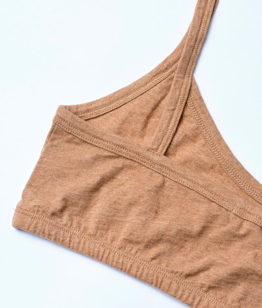 Tan organic cotton tank top folded and displayed in a flat lay style - Industry of All Nations