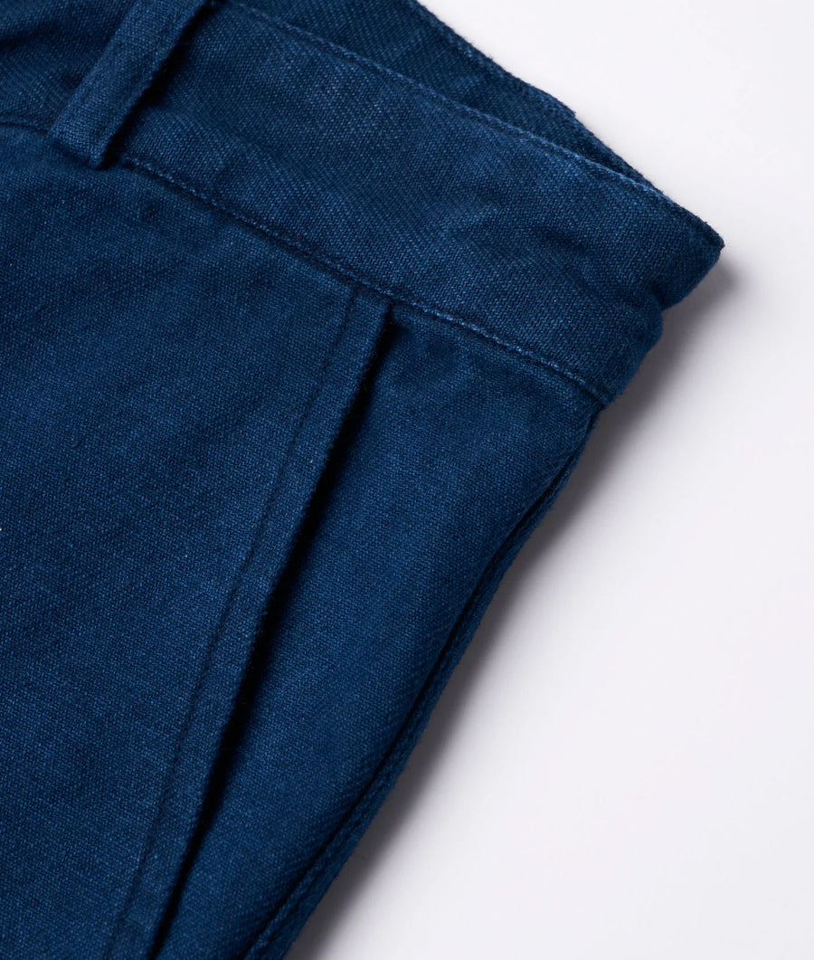 Detail shot of a navy blue organic cotton pant from Industry of All Nations.