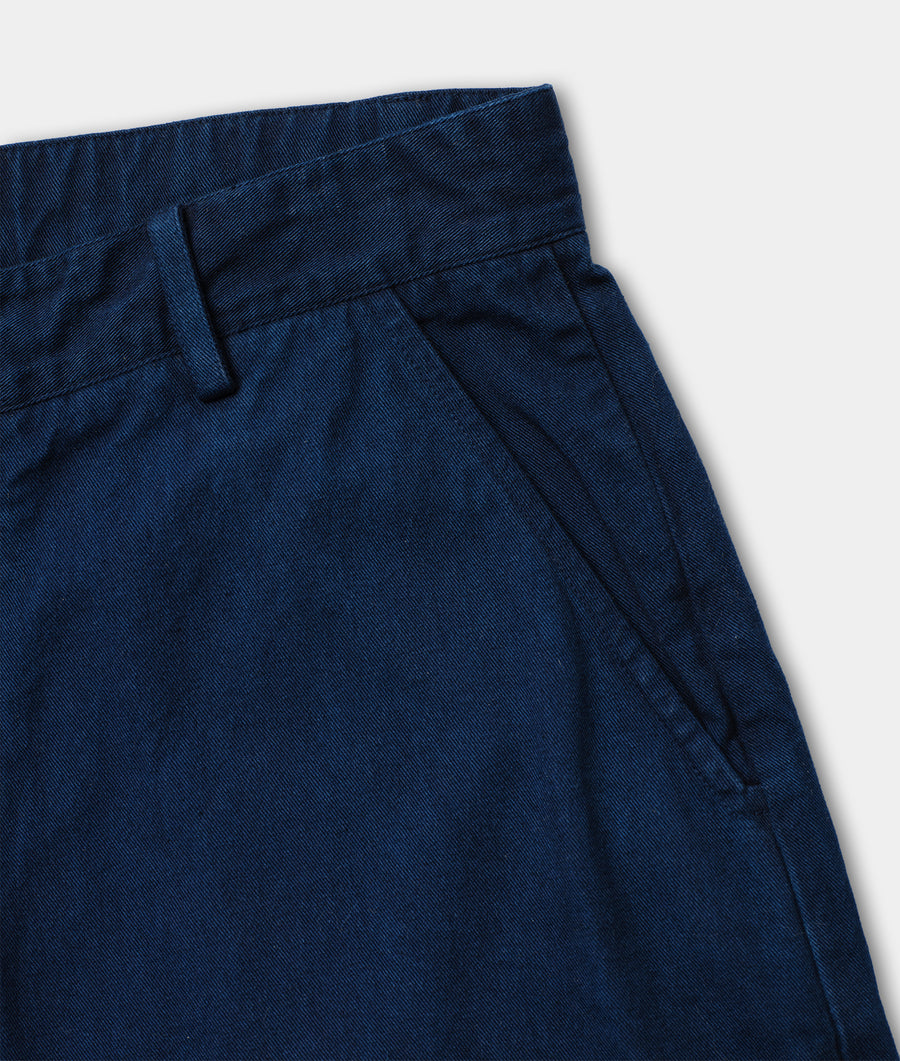 Close-up shot of navy blue pants with pleats and drawstring waist - Industry of All Nations