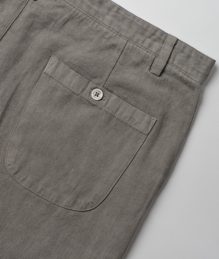 Detail shot of a gray organic cotton button-up shirt from Industry of All Nations.