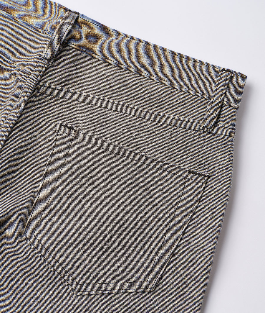 Close-up detail shot of black and white striped cotton pants with pockets - Industry of All Nations