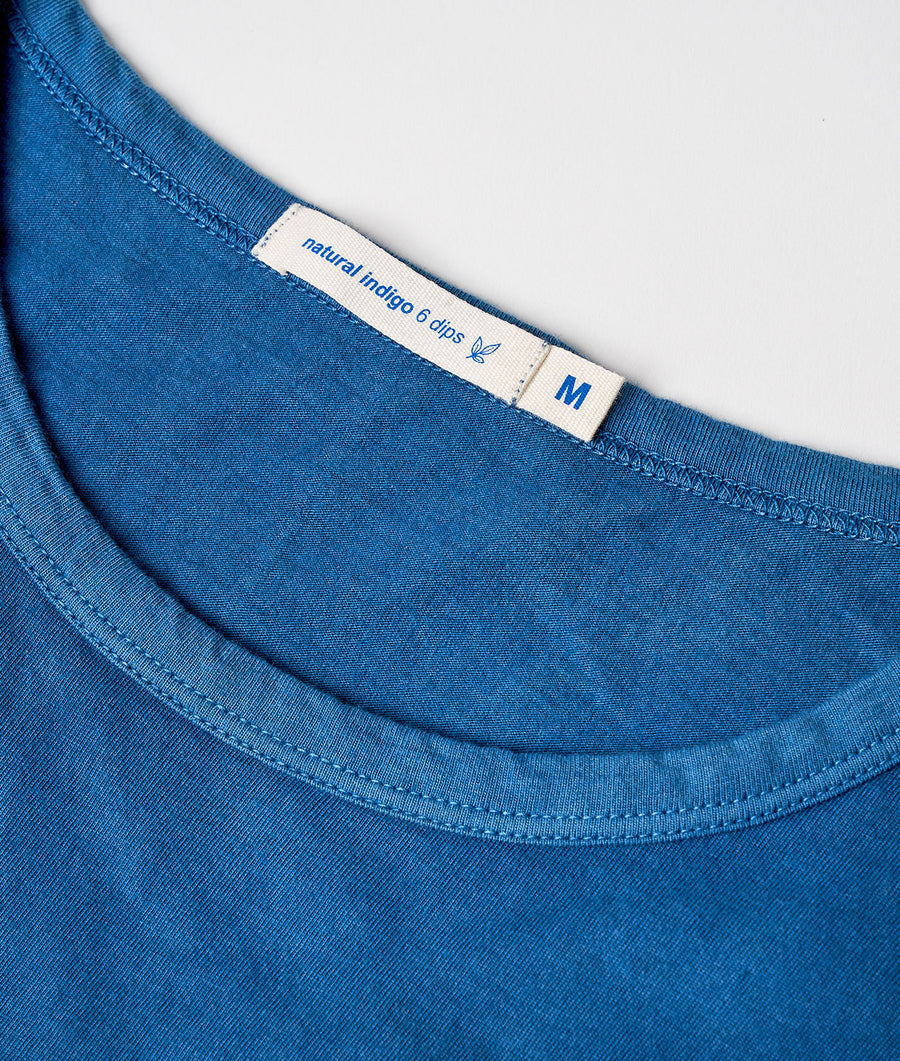 Detail shot of a blue natural indigo 6 dips t-shirt with sizing label - Industry of All Nations