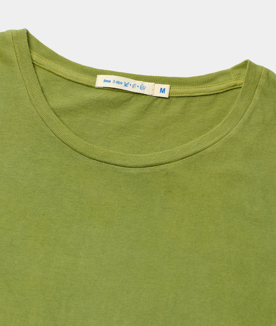 Close-up of a green t-shirt or top with a medium-size tag on the neck - Industry of All Nations