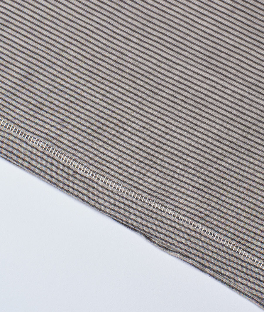 Detail shot of grey and white striped organic cotton fabric - Industry of All Nations
