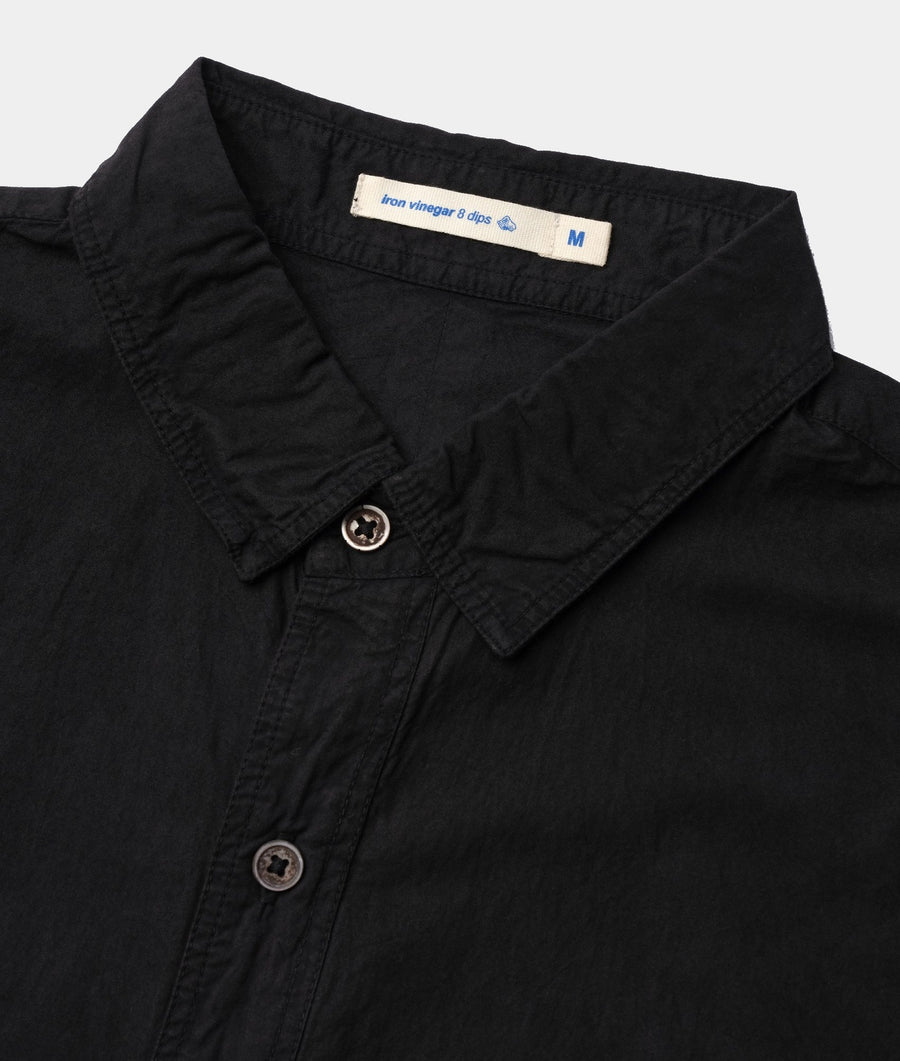 Detail image of a black button-up shirt by Industry of All Nations