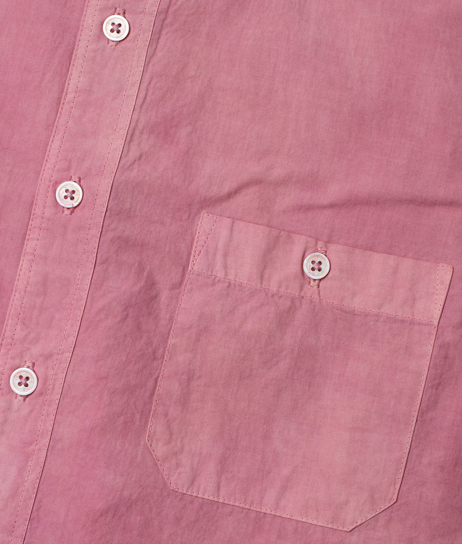 Close-up detail shot of a pink organic cotton button-down shirt with white buttons - Industry of All Nations