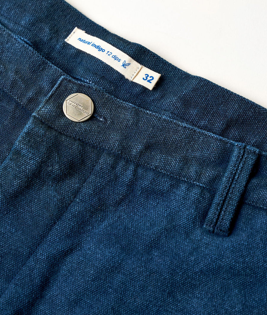 Dark blue denim shorts with "Natural Indigo 12 dips" label and hexagonal metal button - Industry of All Nations