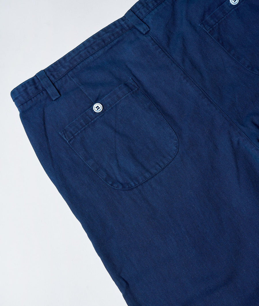 Detail shot of a pair of navy blue cotton trousers with pockets - Industry of All Nations