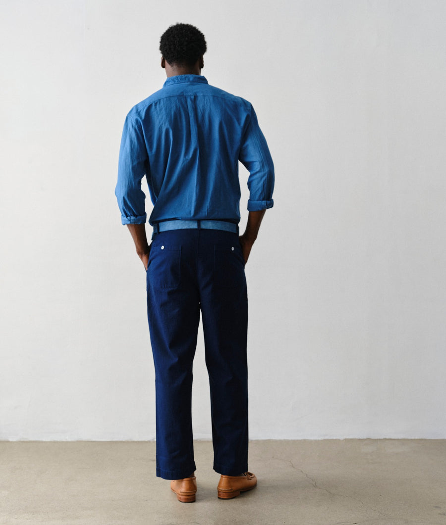 Man wearing Indigo 12 Chinote Pants, back view