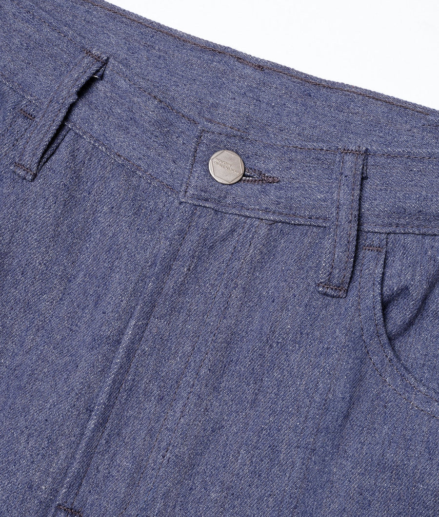Close-up detail shot of a pair of dark blue denim pants from Industry of All Nations.
