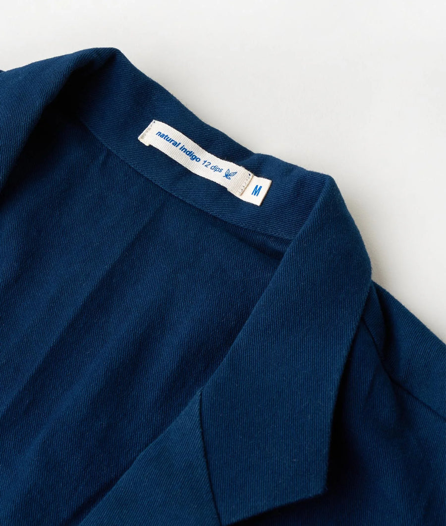 Detail shot of a navy blue natural indigo dyed 12 oz. jacket from Industry of All Nations.