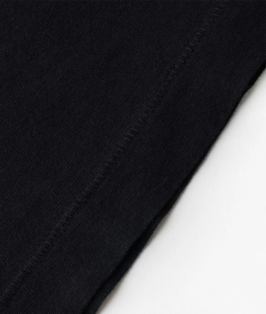 Black organic cotton jersey fabric swatch with textured surface - Industry of All Nations