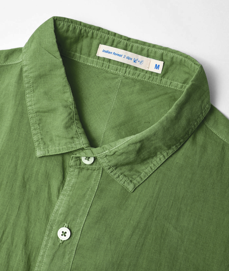 A green, organic cotton shirt with a button-down collar, displayed flat on a white background - Industry of All Nations