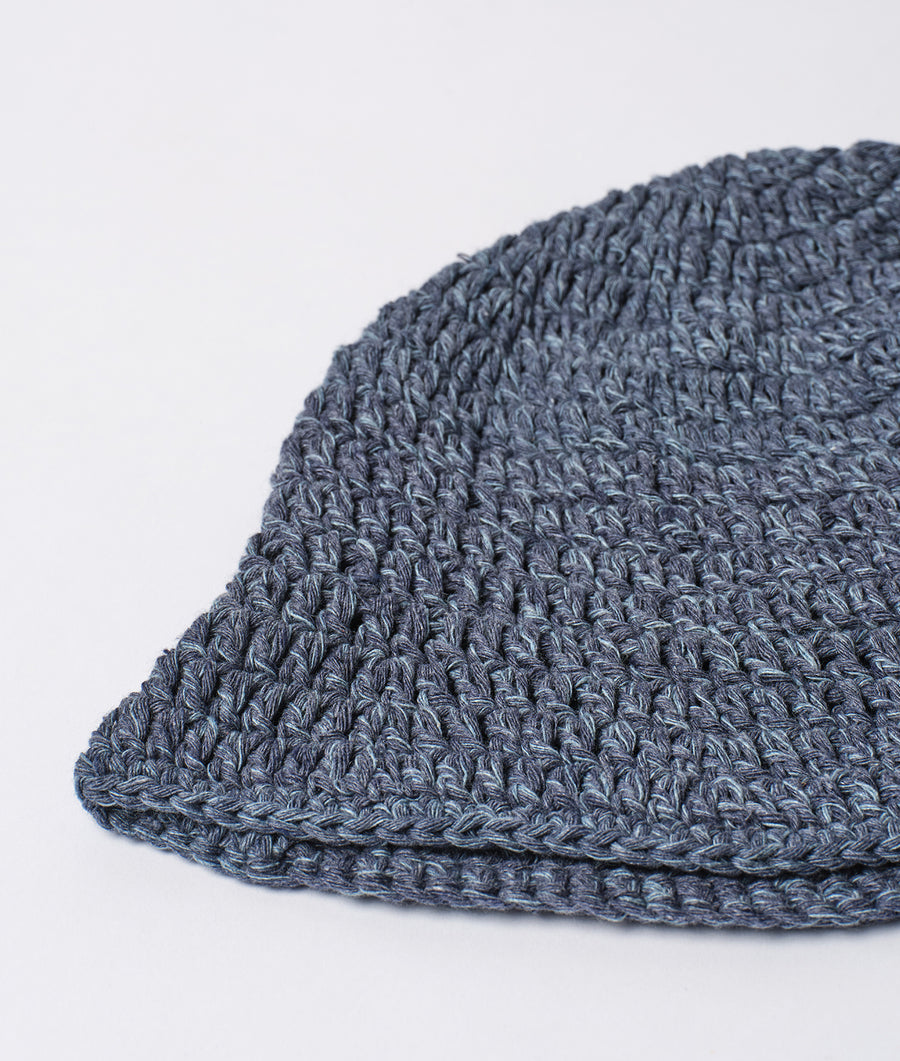 A close-up detail shot of a gray crocheted beanie hat - Industry of All Nations