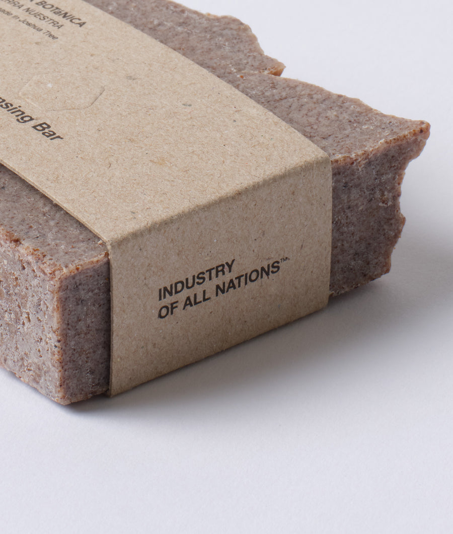 A close-up image of a rectangular brown cardboard box with the text "INDUSTRY OF ALL NATIONS" printed on it - Industry of All Nations