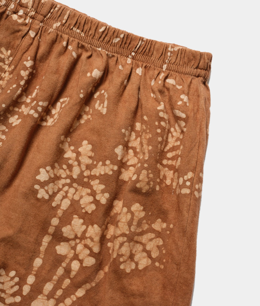Closeup detail shot of a pair of printed brown cotton shorts with an elastic waistband - Industry of All Nations