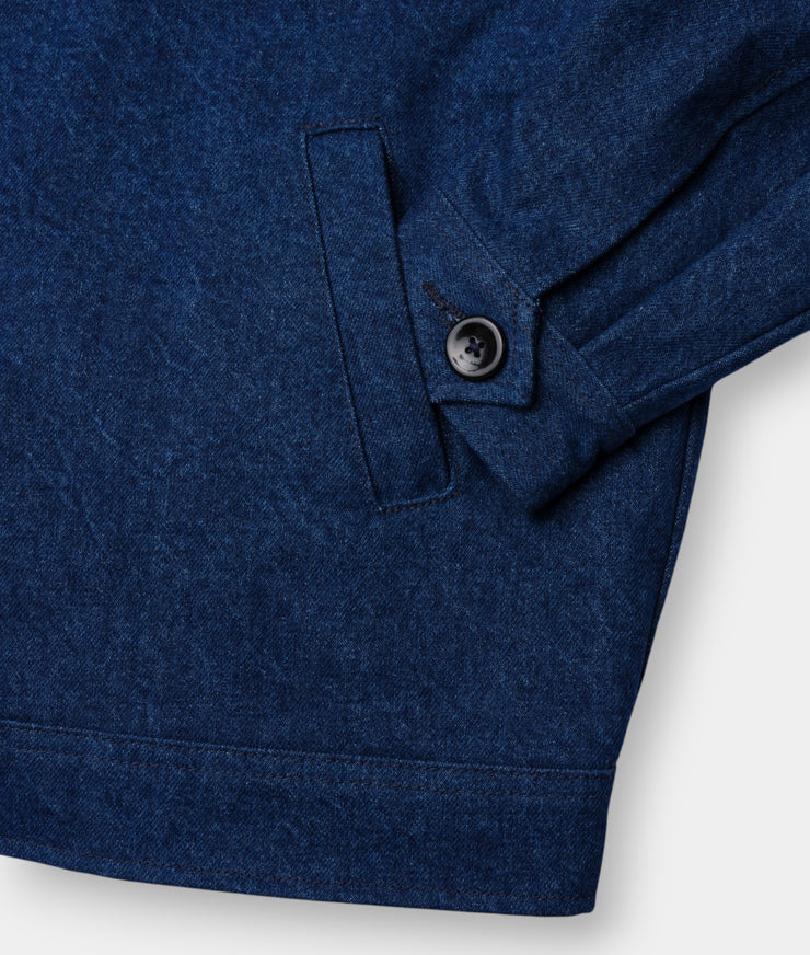 Close-up detail shot of a navy blue organic cotton jacket with a single button closure - Industry of All Nations