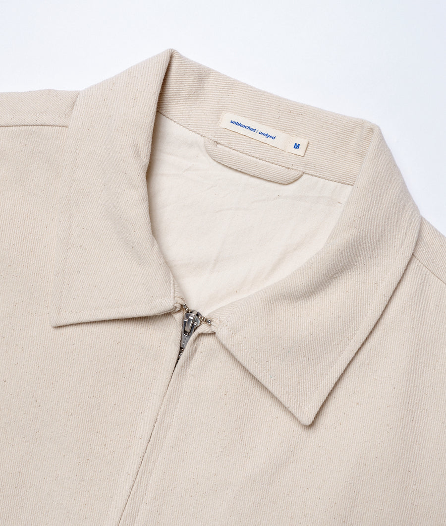 A beige cotton cardigan with a zip closure, displayed on a white background - Industry of All Nations