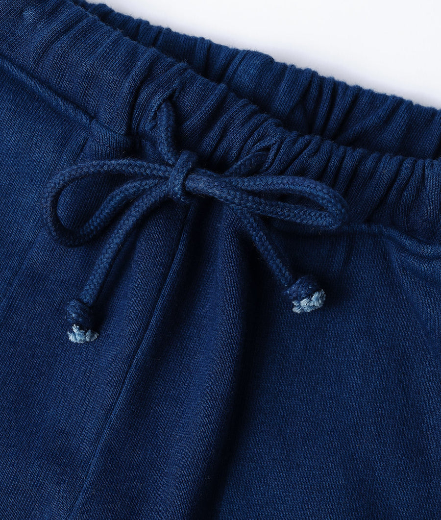Detail shot of navy blue organic cotton drawstring shorts - Industry of All Nations