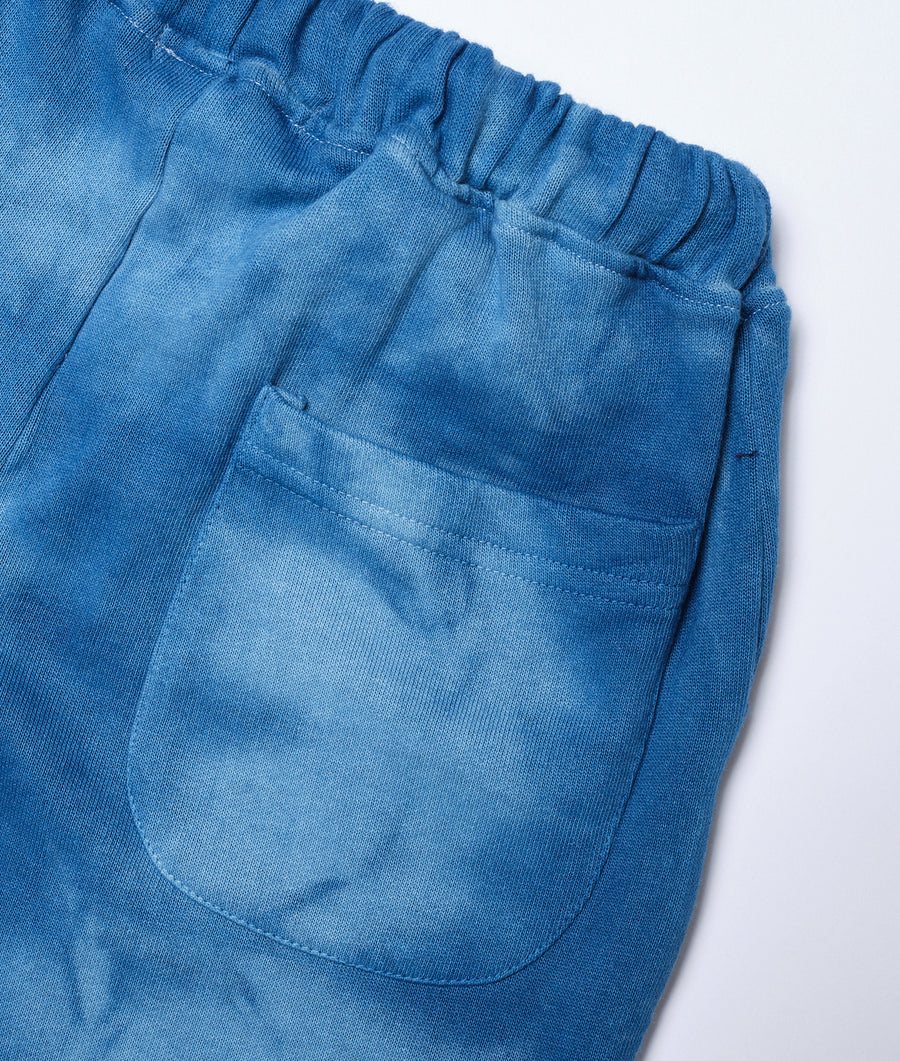 Detail shot of blue cotton elastic-waist shorts with front patch pocket - Industry of All Nations