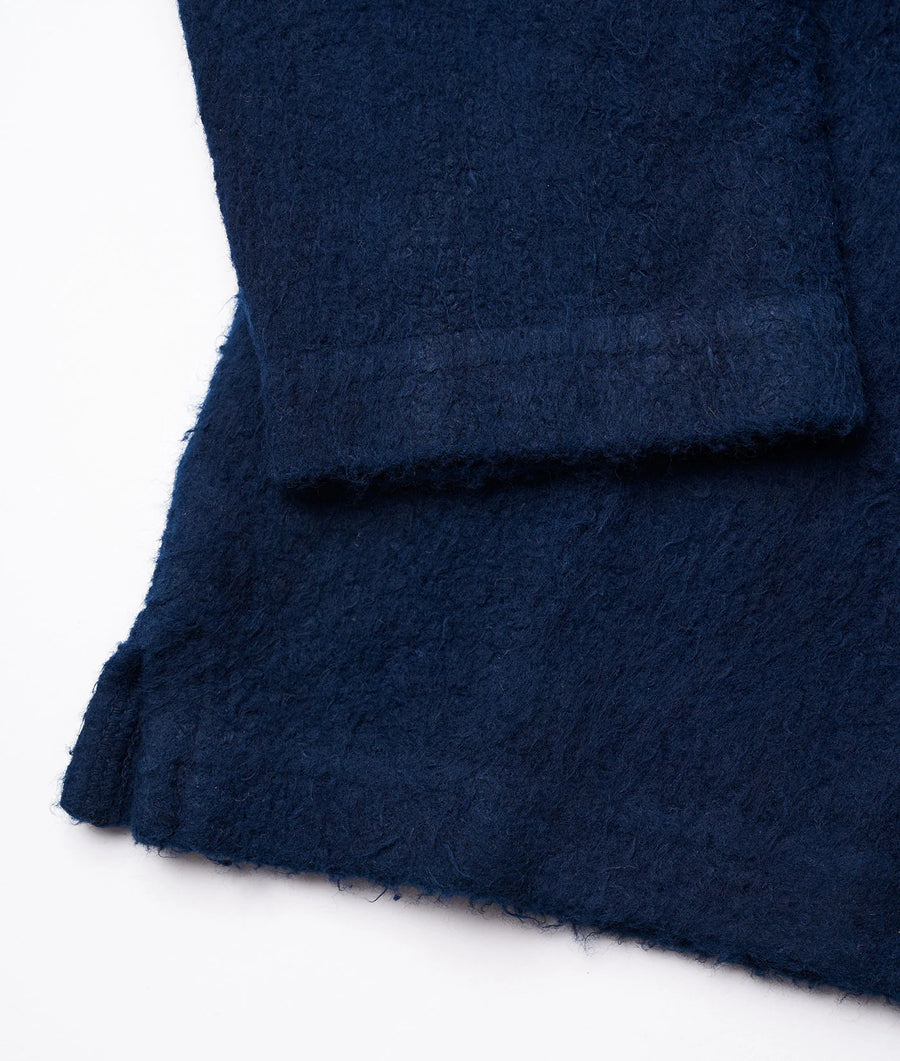 Detail shot of a navy blue wool fabric - Industry of All Nations