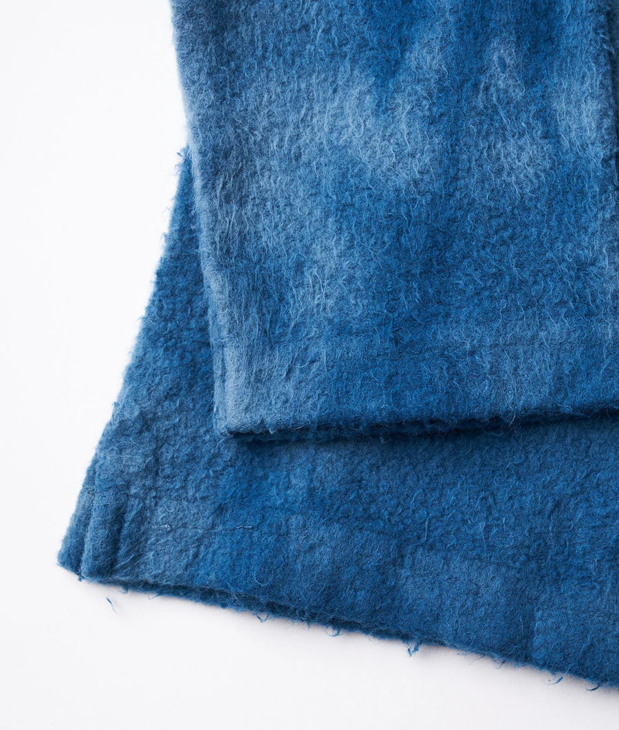 Blue wool scarf in a close-up detail shot showing the textured, fuzzy fabric - Industry of All Nations