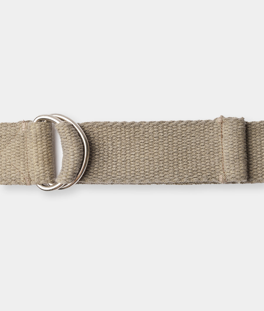 Tan woven cotton belt with dual silver-toned D-ring buckle displayed flat - Industry of All Nations