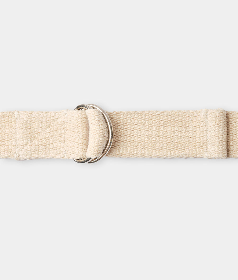 Flat lay image of a cream-colored cotton belt with a metallic buckle - Industry of All Nations