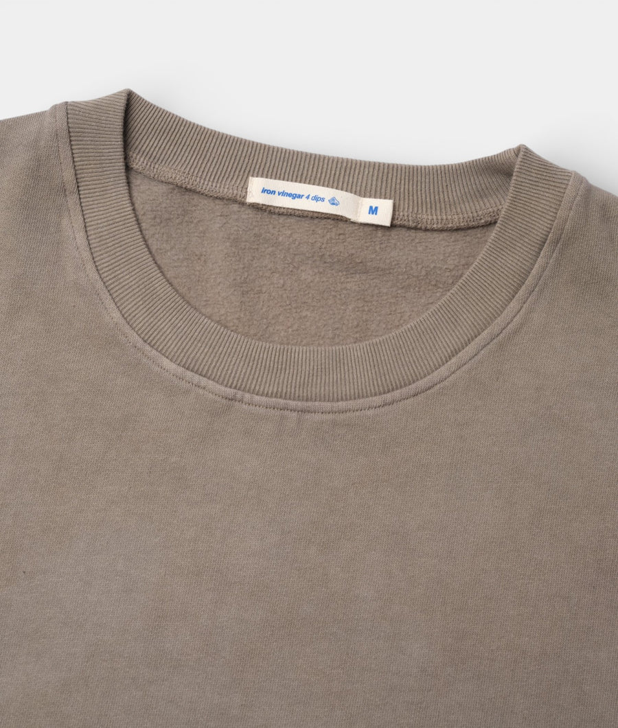Close-up of a medium-sized gray ribbed cotton t-shirt with a crew neckline and a blue tag displaying the brand "Iron vinegar 4 dips" - Industry of All Nations