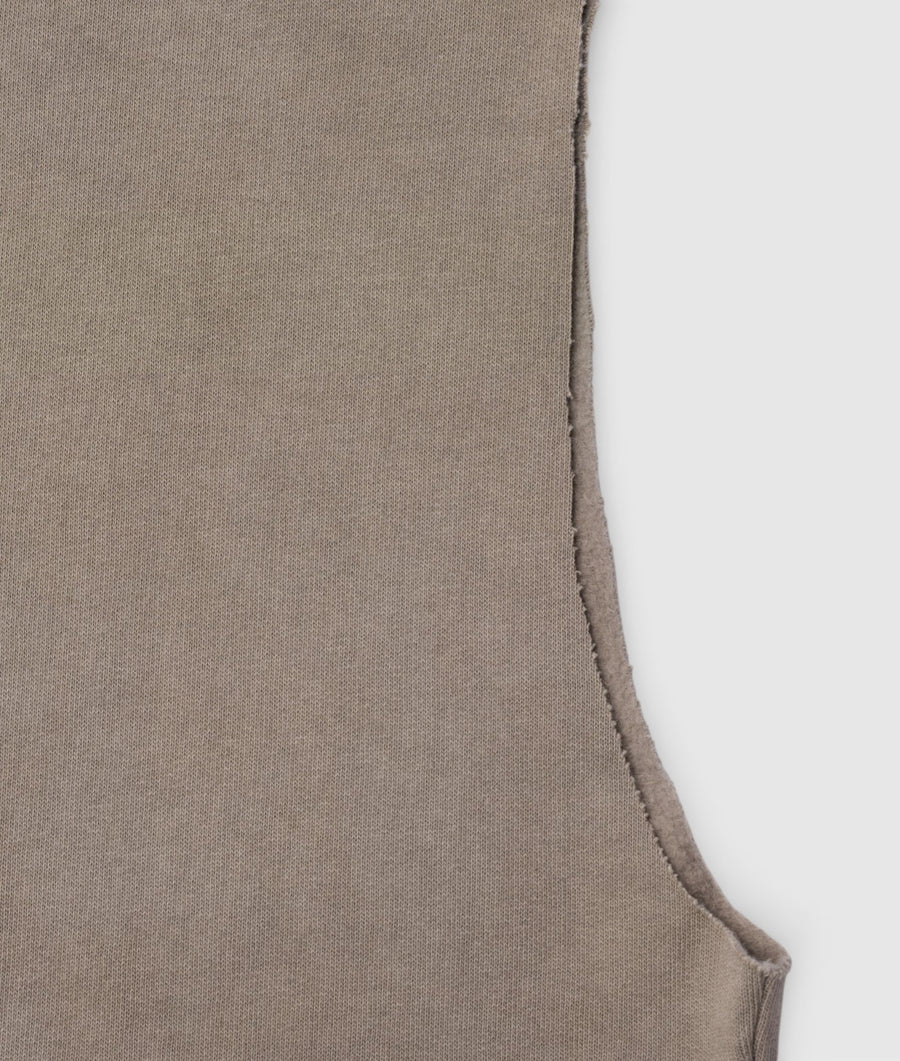 Close-up detail shot of a beige knit sleeveless top or tank top from Industry of All Nations.