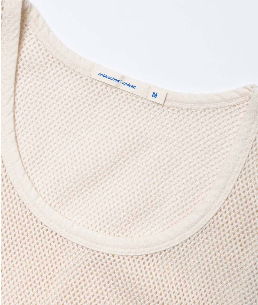 A close-up detail shot of the neckline of an unbleached, undyed cotton sweater with a size M label - Industry of All Nations