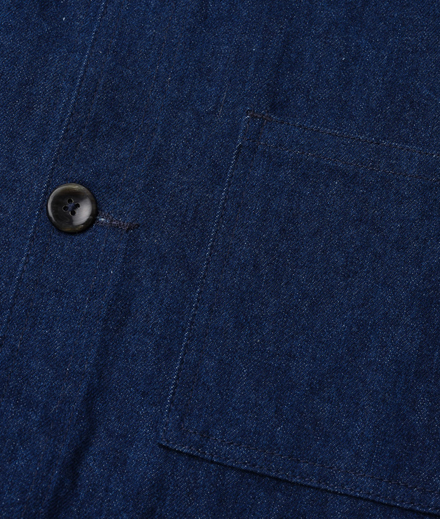 Close-up detail shot of a navy blue denim jacket button - Industry of All Nations