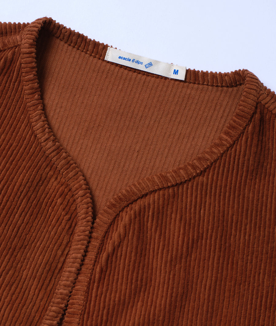 Closeup detail of a brown corduroy top with Acacia 6 dips label - Industry of All Nations