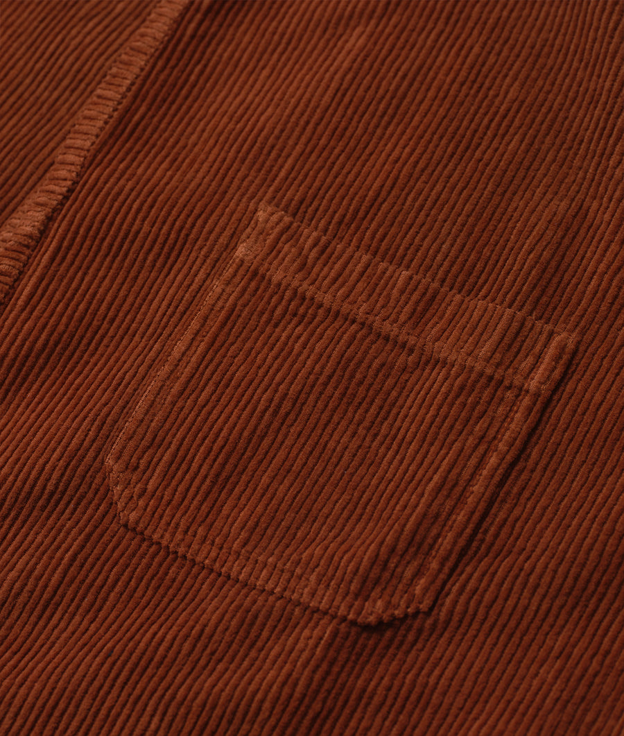 Detail shot of a brown corduroy fabric with distinct vertical striations - Industry of All Nations