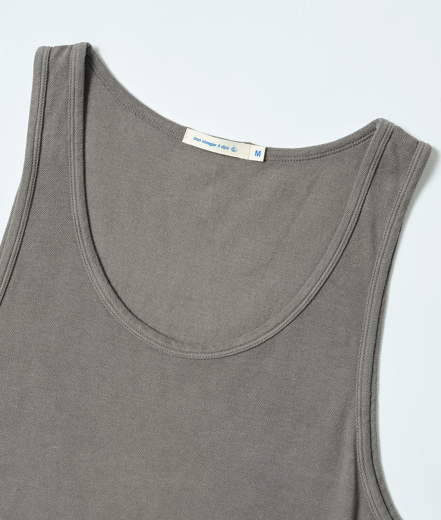 Gray sleeveless tank top with distinctive label sewn onto neckline, displayed in a flat lay - Industry of All Nations