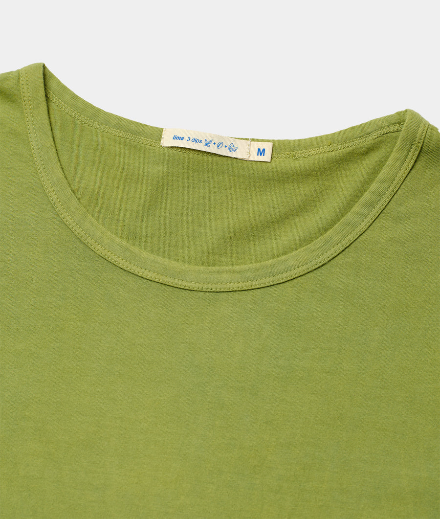 Close-up of a green organic cotton t-shirt with woven size label on the neckline, displayed flat - Industry of All Nations