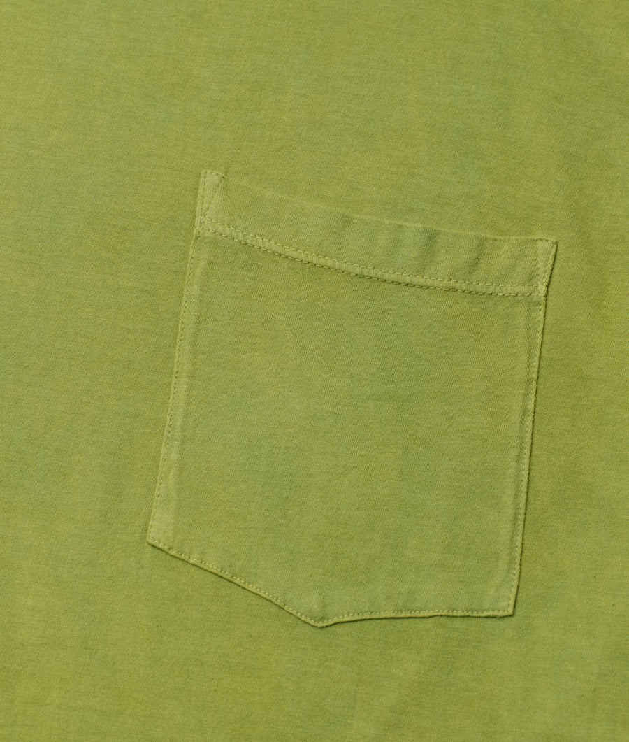 Detail shot of a green organic cotton t-shirt with a single chest pocket - Industry of All Nations