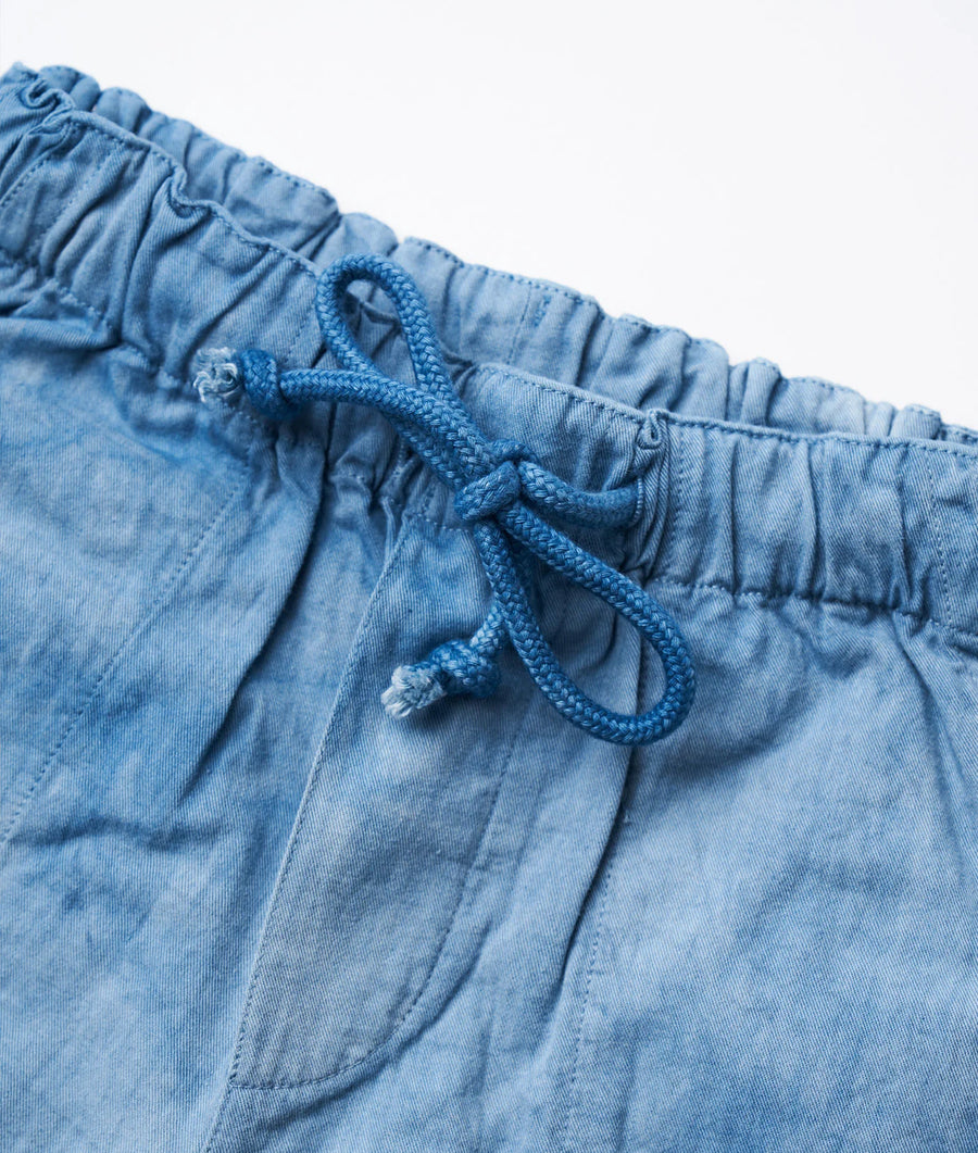 Close-up detail shot of light blue cotton drawstring shorts with braided cord - Industry of All Nations