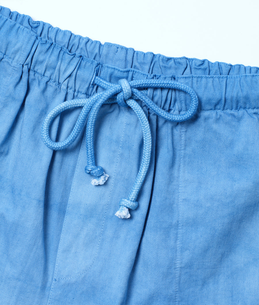 Detail shot of light blue cotton drawstring pants with a braided drawstring - Industry of All Nations
