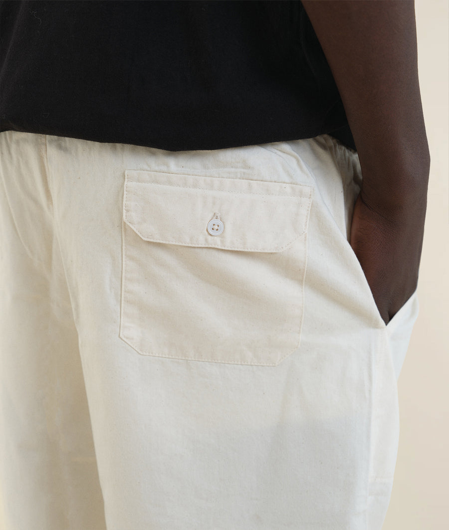 Detail shot of a white cotton pocket on black and white pants - Industry of All Nations