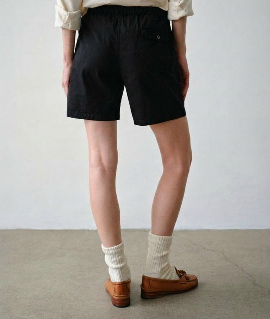 Side view of woman wearing IOAN Ponya Drawstring Shorts in Iron 8