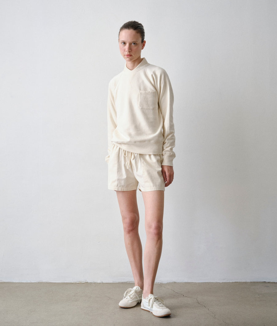 Woman wearing Ponya Shorts and Pocket Sweatshirt in Undyed