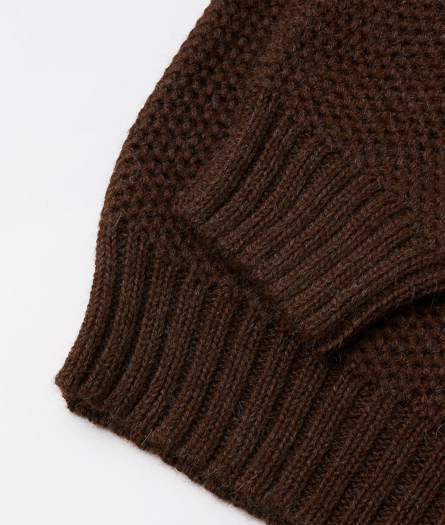 Close-up detail shot of a brown knitted wool winter hat - Industry of All Nations